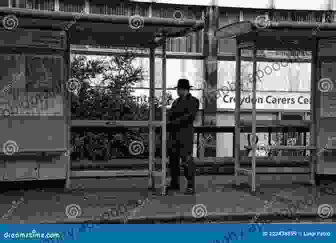 A Solitary Figure Waiting At A Bus Stop, Reflecting The Social And Cultural Significance Of Public Transportation British Buses And Coaches In The Late 1970s